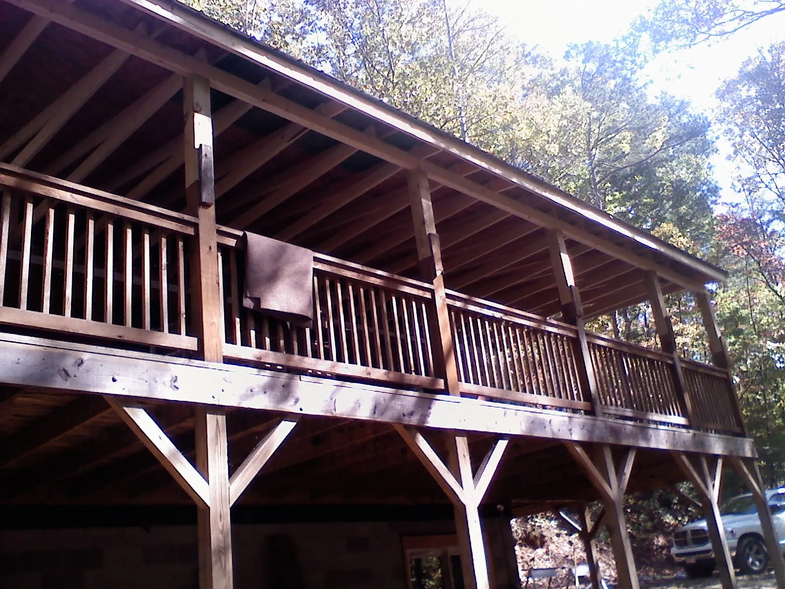 Timber framing under a new elevated porch and deck in Whitinsville